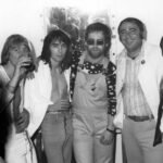 L-R: Dee Murray, Nigel Olsson, Elton John, Russ Regan, Rick Frio at Troubadour Club. Courtesy of Rick Frio